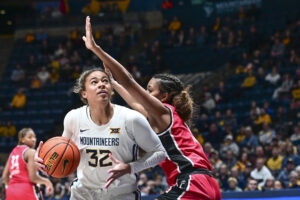 Kyah Watson's 14 points leads a balanced attack, as No. 24 WVU improves to 13-0
